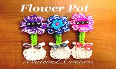 three crocheted flower pot holders sitting on top of a wooden table