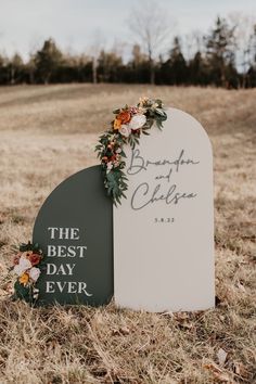 a couple of headstones sitting on top of a grass covered field