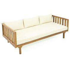 a wooden couch with four pillows on it's back and sides, against a white background