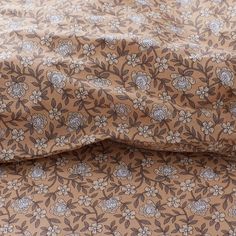 a brown and white floral print sheet set