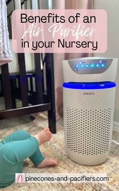 a baby laying on the floor next to an air purifier in your nursery