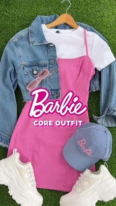 a pink dress, denim jacket and hat laying on the grass with text barbie core outfit