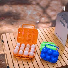 an egg carton with eggs in it sitting on a table next to a box of eggs