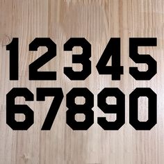 the numbers are written in black on a wooden surface