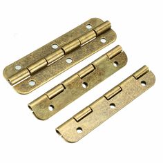 three brass plated door hinges with holes