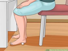 a woman sitting at a desk with her legs crossed