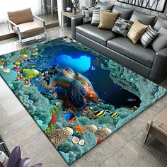 a living room area rug with a turtle swimming in the ocean surrounded by fish and corals