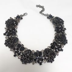 Our ZIA statement choker is a luxury black rhinestone piece. It is a fully embellished choker with black jewels within a dark base. Also available as a longer necklace and with matching earrings. Arrives in luxury branded gift box perfect for gifting and storage. Material: Zinc Alloy / Rhinestones Size: L30cm / W3.2cm with adjustable chain to fit all sizes Weight: 100g Jewellery Minimal, Minimal Choker, Black Choker Necklace, Rhinestone Choker Necklace, Black Jewel, Crystal Choker Necklace, Statement Choker, Diamond Choker, Rhinestone Choker