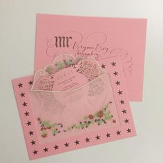 two pink cards with flowers and stars on them