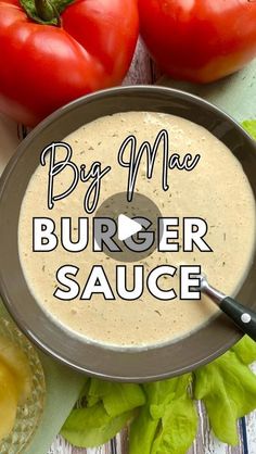 an image of a burger sauce in a pan with tomatoes and lettuce on the side