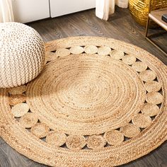 a large round rug on the floor in a living room