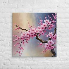 a painting of pink flowers on a tree branch in front of a white brick wall