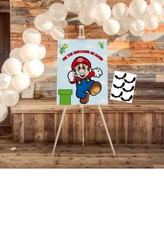 a mario birthday party with balloons and decorations