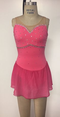 a female figure in a pink leotard with sequins on the bust