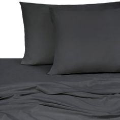 two black pillows on top of a bed