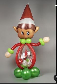 an inflatable christmas ornament with a elf on top