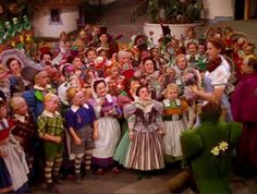 there are many children dressed up in costumes and standing together for a group photo on the set