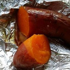 two pieces of food sitting on top of tin foil