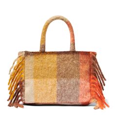 Colette handbagFringes on the sidesDetachable shoulder strapLogo embroidered on the frontOrange and brown all over patternSoft and woolly fabricSizes: 30cm X 22cm X 12cm Multicolor Shoulder Bag For Shopping In Fall, Multicolor Shoulder Bag For Fall Shopping, Fall Multicolor Shoulder Bag For Shopping, Rectangular Bags With Tassels For Fall, Fall Rectangular Bag With Tassels, Rectangular Fall Bag With Tassels, Multicolor Bags With Leather Handles For Fall, Multicolor Leather Handle Bags For Fall, Fall Multicolor Bags With Leather Handles