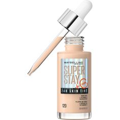 Turn up your skin with Super Stay Up to 24HR Skin Tint! This non-stop power, light weight foundation drops are infused with Vitamin C and creates a bright, natural look that lasts all day. Our vegan formula brightens and delivers beautiful skin-like coverage for a natural, radiant finish. 95% said skin looks healthy. Weightless foundation feel. Resists sweat, humidity and fading. Suitable for all skin types, including sensitive skin. Shake bottle well, apply a few drops with fingers or beauty bl Superstay Maybelline, Dewy Foundation, Brightening Skincare, Medium Coverage Foundation, Glow Primer, Maybelline Superstay, Maybelline Makeup, Skin Tint, Maybelline Super Stay