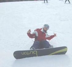 a person on a snowboard in the snow