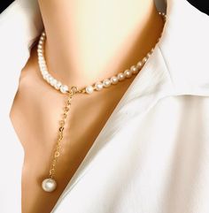 Elevate your elegance with this Timeless Classic Pearl Necklace, featuring lustrous freshwater white semi-round pearls of AAAAA quality and a delicate gold-filled heart chain. Perfectly blending sophistication and romance, this necklace is a must-have accessory for any special occasion, from weddings to everyday glamour. A 10mm round pearl charm adds a refined touch, making this necklace not only a statement of style but also a meaningful keepsake. The gold-filled heart chain provides a subtle, Classic Pearl Necklace, Heart Chain, Chain Extenders, Pearl Charms, Elegant Necklaces, Freshwater Pearl Necklaces, Earrings Collection, Perfect Gift For Her, Timeless Classic