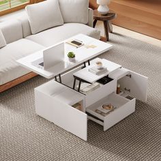 a white coffee table sitting on top of a carpeted floor next to a couch