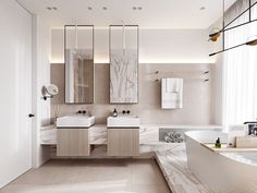 a large bathroom with two sinks, tub and mirrors on the wall next to each other