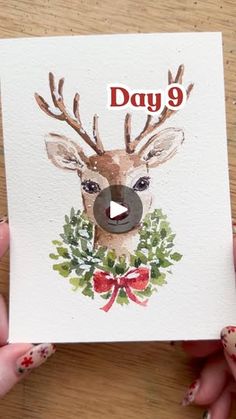 someone is holding up a card with a deer on it and the words day 9