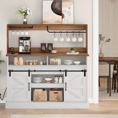 a coffee bar in the corner of a room with white walls and wooden flooring