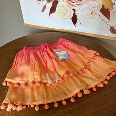 Majorelle Womens Pom Pom Trim Tiered Hem Calypso Skirt Nwt Orange, Pink, Ombre Small 100% Viscose Shell, 100% Cotton Lining Fully Lined Elasticized Waist Tiered Hem Pom Pom Tassel Trim 16" Flat Summer Pink Tiered Mini Skirt, Flowy Tiered Orange Skirt, Pink Tiered Cotton Mini Skirt, Yellow Flowy Tiered Mini Skirt, Pink Voluminous Tiered Skirt, Flowy Mini Skirt, Ruffled Mini Skirt, Tiered Mini Skirt, Pink Tweed