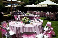 tables and chairs are set up for an outdoor event