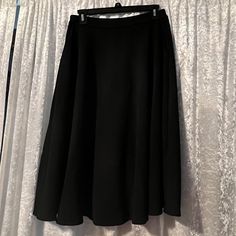 Brand New, Never Worn Classic Black Maxi Skirt For Spring, Black Maxi Skirt For Winter Evening, Classic Black Flared Maxi Skirt, Fitted Black Classic Maxi Skirt, Classic Fitted Black Maxi Skirt, Classic Black Lined Maxi Skirt, Black Relaxed Classic Maxi Skirt, Classic Relaxed Black Maxi Skirt, Classic Black Pleated Maxi Skirt