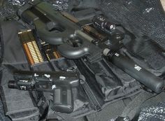 FNH - PS90 with Suppressor and FN5.7 pistol.   Best two guns on the market. Police Gear, Zombie Survival, Freedom Fighters