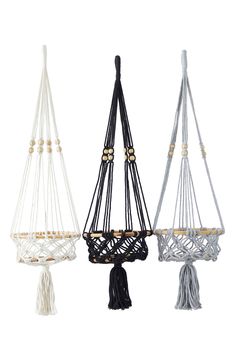 three macrame style hammocks with tassels