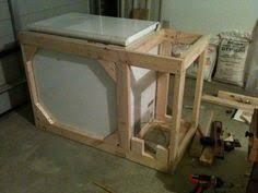 an unfinished kitchen counter being built in a garage