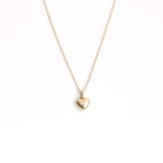 Capture hearts with our adorable 14 Karat solid gold puffy heart necklace. This charming piece is the perfect accessory to showcase your sweet and playful side. Crafted with love and attention to detail, it adds a touch of cuteness to any outfit and makes a delightful gift for yourself or a loved one. 11mm x 7.5mm *All our pieces are made to order and beautifully crafted specifically for you. Please confirm sizing before placing your order and allow 14-21 days from purchase to complete and ship Hallmarked Heart-shaped Dainty Necklace, 14k Gold Tarnish-resistant Heart Necklace For Valentine's Day, Puffy Heart Necklace, Gold-tone Heart Pendant Necklace For Valentine's Day, Valentine's Day Gold-tone Heart Pendant Necklace, Necklace Cute, Puffy Heart, 21 Days, Heart Pendant Necklace