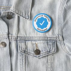 a blue jean jacket with an orange and white badge on the back, which says little sunshine