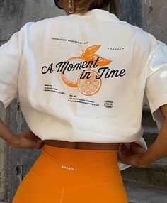 A Moment In Time T shirt Easy 30 day return policy Athleisure T-shirt With Letter Print, Orange Short Sleeve T-shirt With Text Print, Athleisure Graphic Print T-shirt For Everyday, Everyday Athleisure Graphic T-shirt, Orange Relaxed Fit T-shirt With Letter Print, Orange Letter Print T-shirt For Spring, Spring Athleisure Tops With Screen Print, Orange Athleisure Top For Streetwear, Everyday Athleisure Tops With Letter Print