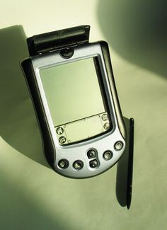 an electronic device with a pen on top of it