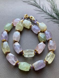 Beautiful necklace made of a mix of Natural Amethyst, prehnite, citrine, rock crystal and rose quartz with gold-plated details, clasp. This necklace has a luxurious look, is perfect to wear solo, but you can also combine it. This necklace is versatile and can be worn on special occasions or combined with casual outfits, for a touch of charm. ☀️Stone: natural stone Amethyst, citrine, prehnite, pink, mountain quartz Facet nugget Size: 10-13x15-17mm without color treatment, amethyst 8mm and 3mm ☀️The length is approximately 58 cm ☀️Details and clasp are gold-plated I also accept custom orders for jewelry: earrings, necklaces and sets. Jewelry comes in a velvet pouch so you can keep it safe while traveling or if you want to give it as a gift. The invoice will be included upon request. Also che Luxury Nature-inspired Necklace With Gemstone Beads, Luxury Unique Gemstone Beads, Luxury Artistic Gemstone Necklaces, Luxury Agate Jewelry With Gemstone Beads, Luxury Faceted Beads Jewelry For Women, Bracelets Design, Natural Stones Necklace, Unique Necklace