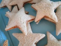 star shaped cookies are on a blue plate