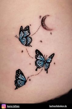 three blue butterflies flying in the sky with a half moon behind them and stars on their backs