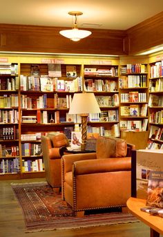 a library filled with lots of books and furniture