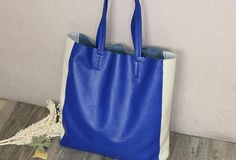 Overview:Design: Handmade Vintage Tote BagIn Stock: Made to order (4-7 days)Include: Tote + A detachable Side InnerCustom: NoColor: Blue&WhiteLeather: Head Layer Cowhide LicheeMeasures: 48cm /Bottom 37cm x 40cm x 11cmWeight: 0.75 kgSlots: 1 slotAccessories(option): NoStyle: Tote Bag, Shoulder bag, Handbag, Shopper bagVery durable (At least 5 Years) and it should last a life timeNote:Each item will have very slight variances to the pictured item, and the consequence is that you can assure that ea Color Block Tote Bag, Leather Bag Handmade, Overview Design, Color Block Tote, 2023 Wishlist, Needle Felting Tutorials, Felting Tutorials, Handbag For Women, Leather Bags Handmade