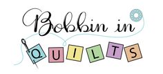 the words dublin in quilts are spelled by blocks and sewing needles on a white background