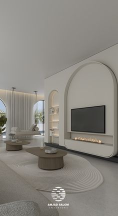 a living room with white furniture and a flat screen tv