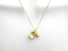 "Acorn and oak leaf necklace, Acorn necklace, Oak leaf necklace, Woodland necklace, Gift for birthday, Gift for girlfriend, Gift for mom Minimal dainty gift jewelry Item details ♪ Color: gold ♪ Necklace length: 15-19\" 14K gold plated ♪ Anything longer 20\" will be an additional charge ♪ Please choose the chain material when you check out  ♪ Packed individually in a gift box Handmade with Love by Clara ---------------------------------------------- ► Enter shop here : https://www.etsy.com/shop/j 3d Necklace, Acorn Jewelry, Oak Leaf Necklace, Gift Box Handmade, Acorn Pendant, Birthday Gift For Girlfriend, Acorn And Oak, Acorn Necklace, Box Handmade