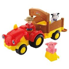 a wooden toy truck with two farm animals in it's bed and an animal on the back