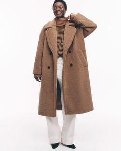 Wrap up in cozy luxury with this oversized faux shearling coat. Featuring an exaggerated notch collar, double-breasted design and welt front pockets, it's perfect for layering over any outfit. Teddy Coat Street Style, Long Teddy Coat, Cozy Luxury, Coat Street Style, Faux Shearling Coat, Teddy Coat, Camel Coat, Winter Outfits For Work, Notch Collar